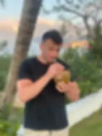 Cameron Benson drinking coconut water