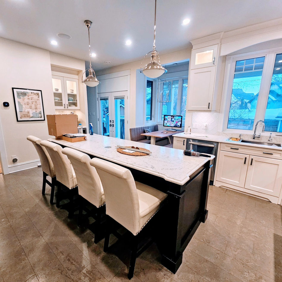 Modern kitchen island with seating, white cabinets