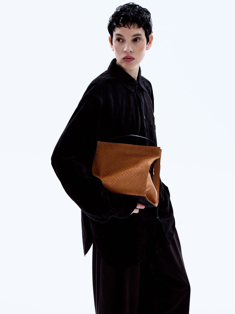 Hand-made woven leather bag with leather tassle zipper and contrast paneling