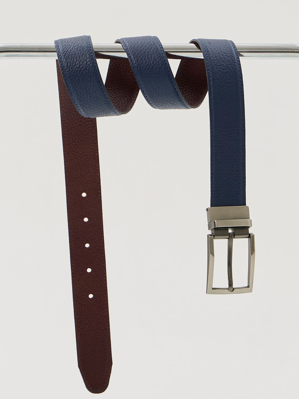 Two-tone buffed calfskin belt made reversible by a spring-lock mechanism