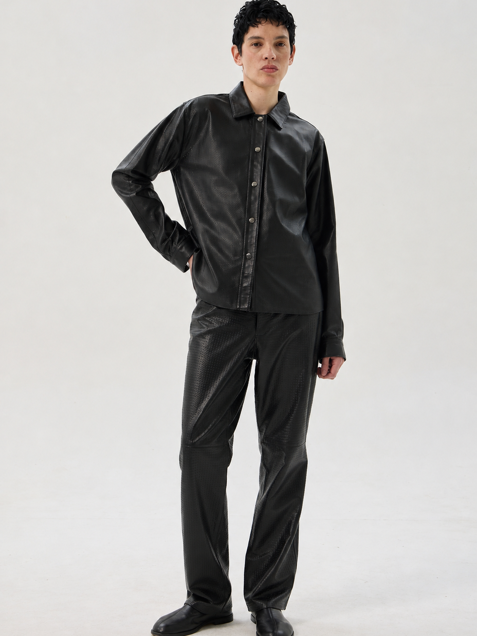 Black calfskin straight leg trousers with laser-cut detailing