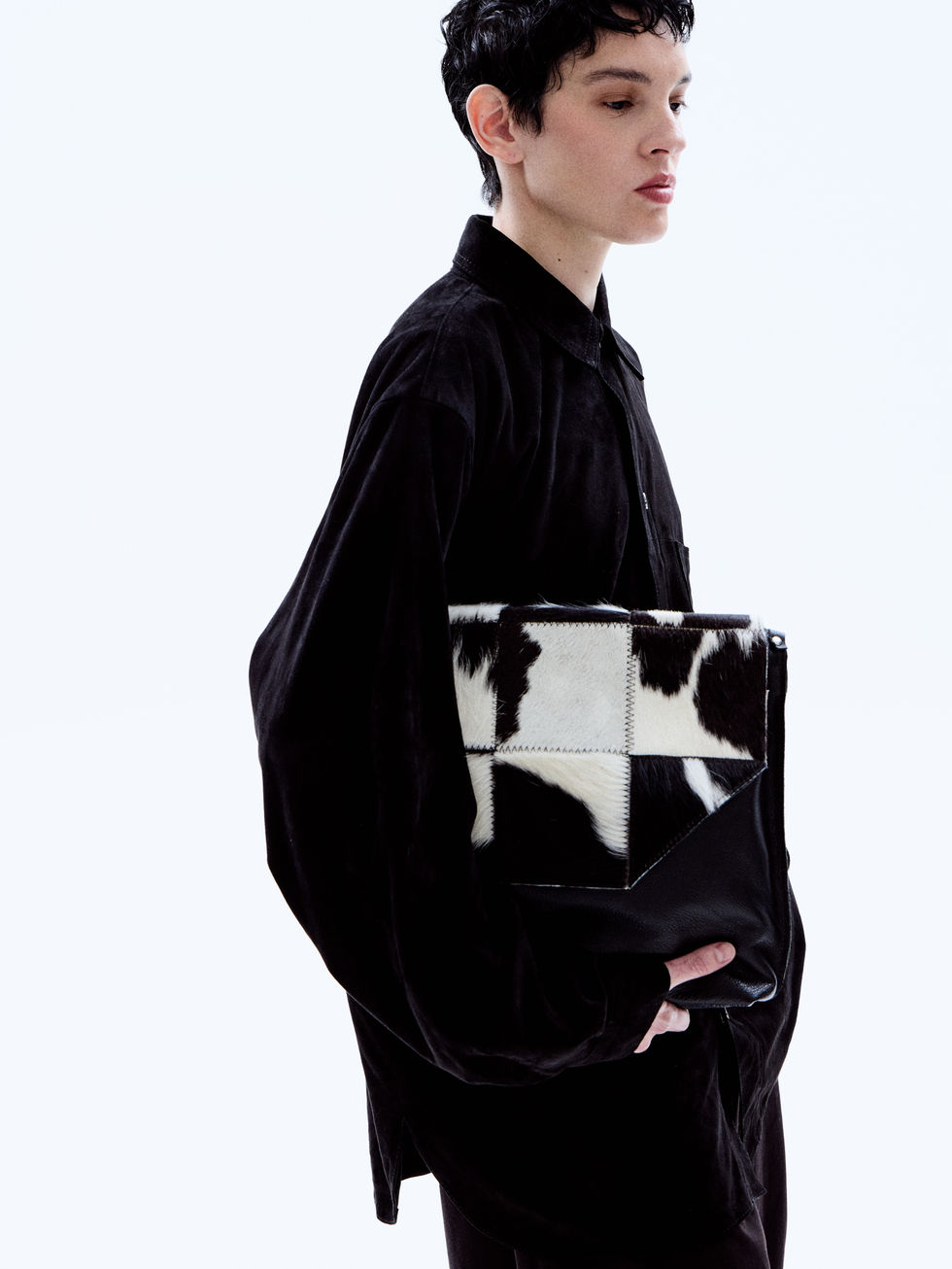 Full-grain Napa calfskin crossbody bag with geometric cowhide-patterned paneling