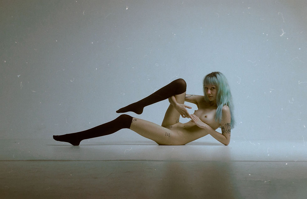 model posing in a studio on a film photograph