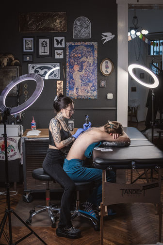 Tattoo artist working in her workshop