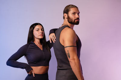A female and a male model posing on a photoshoot