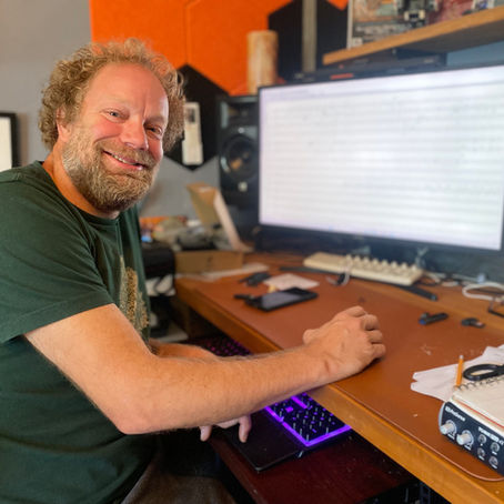 Man in a studio working on music composition