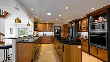 Gourmet kitchen with wood cabinetry in Ft. Pierce Florida home