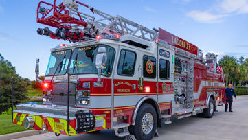 eal Estate Photographer capturing images of a fire truck at Martin County Fire Station, highlighting the vehicle's details and significance in an active fire station setting.