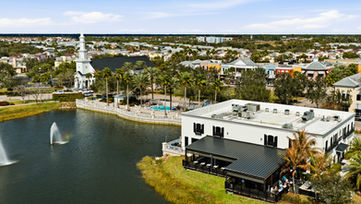 Downtown Port St. Lucie lakefront buildings and fountain aerial view