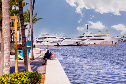 Luxury yachts cruising along the West Palm Beach Intracoastal Waterway photographed by Edwin Figueroa Photography