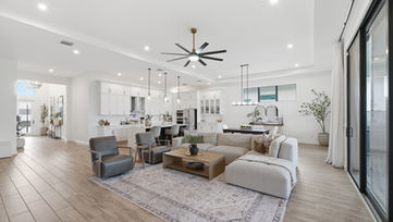 Spacious living room wide shot showing open floor plan and modern interior design in Port St. Lucie