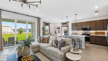 Builder model home living room in Port St. Lucie with open floor plan