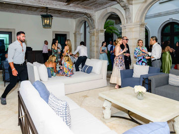Elegant corporate event photography in West Palm Beach showcasing guests enjoying a private celebration