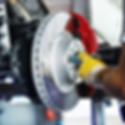 "Mechanic working on a high-performance disc brake system during a brake service or repair."