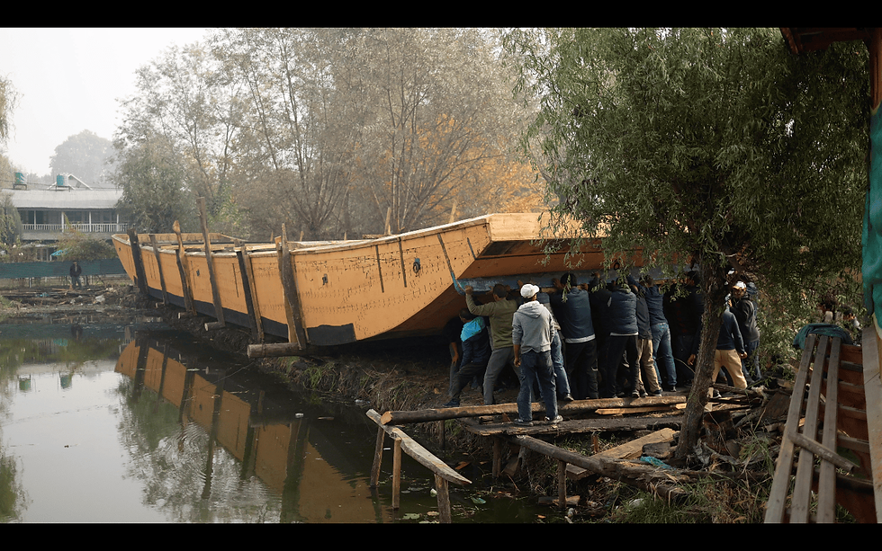 Ceremony of the hull of the boat being pushed into the water at Nigeen lake, November 2024. Photo credit: Anto Gloren and Sayali Athale.