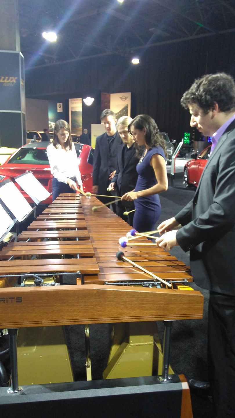 Trying out the marimba, car show