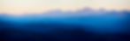 serene-view-of-rolling-mountains-in-shades-of-blue-2026-03-25-08-38-34-utc.jpg