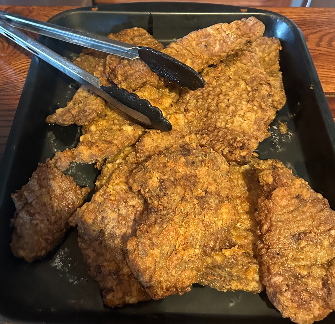 A variety of assorted meats including ground beef and roasts in a dinner box.
