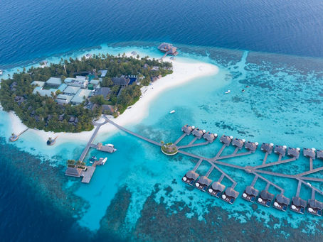 Aerial view of pristine tropical beach with turquoise water in the Philippines - diving season guide