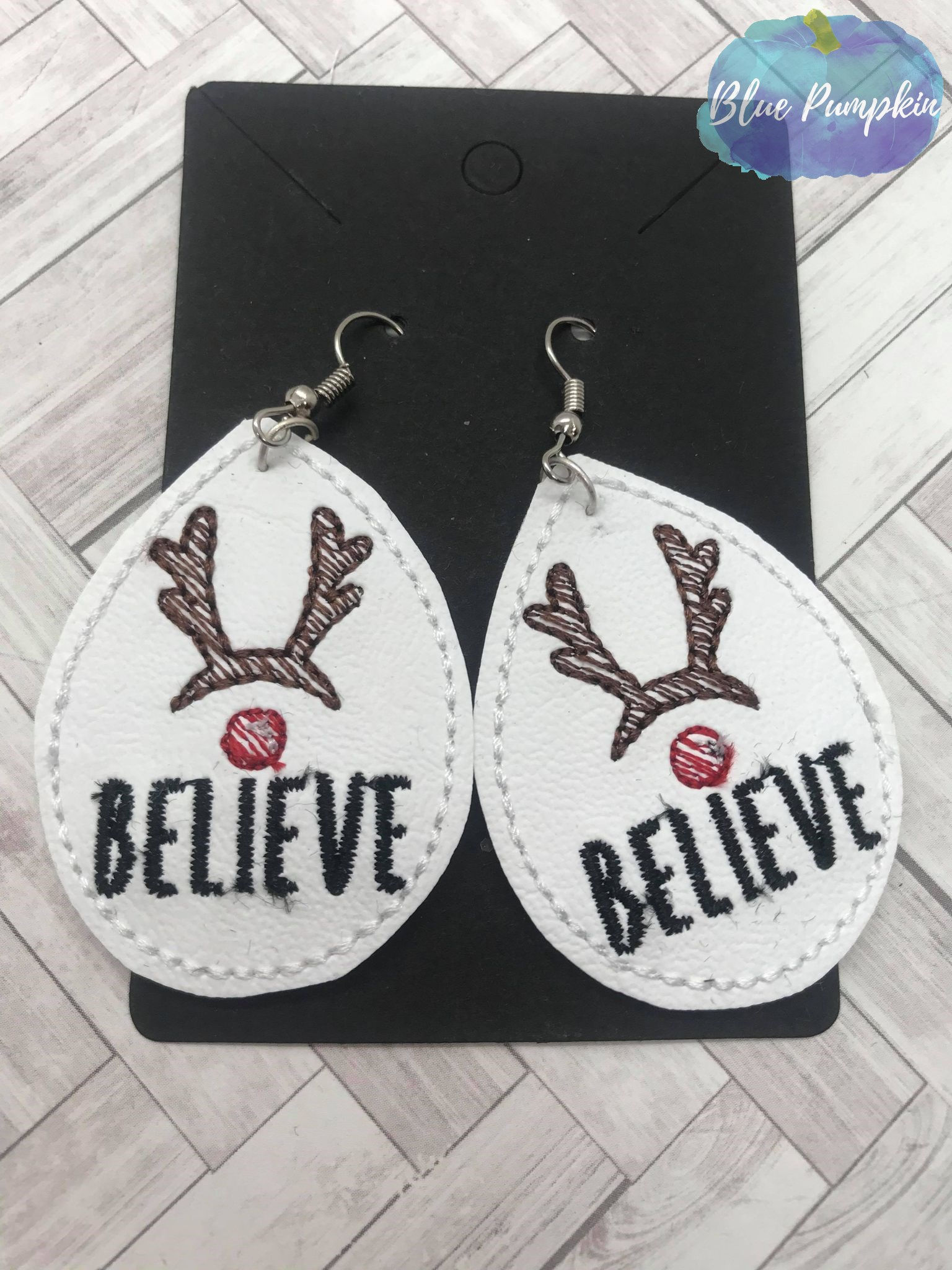 Oval Believe Reindeer Earrings