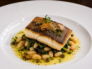 Branzino con Pelle Croccante, Cannellini, Cicoria Saltata, Capperi Fritti e Chips di Aglio - Crispy Skin Mediterranean Sea Bass with Cannellini Beans, Sautéed Chicory, Fried Capers and Garlic Chips