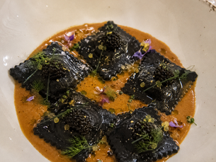 Ravioli Neri al Nero di Seppia con Astice, Stracciatella e Caviale Oscietra - Finished with Bisque di Astice al Cognac, Lime e Olio all'Erba Cipollina