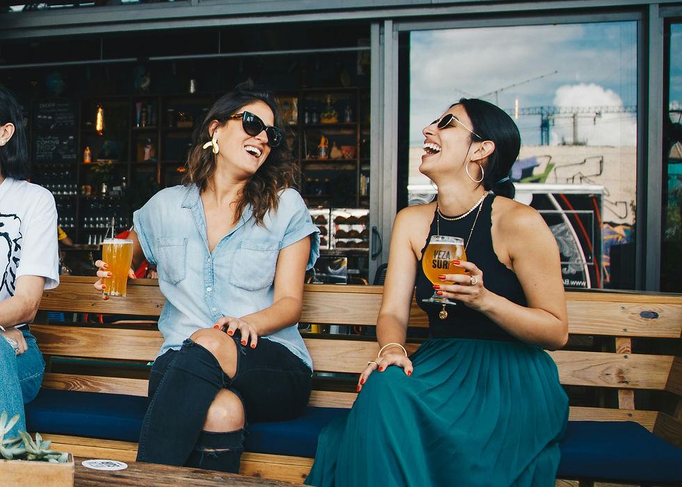 two strangers meeting for the firsts time and enjoying a beer on a sunny day