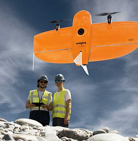 Surveyors operating a WingtraOne VTOL mapping drone on site
