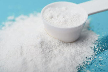 Creatine monohydrate powder and scoop, plain background, New Zealand (no specific product featured in this post)