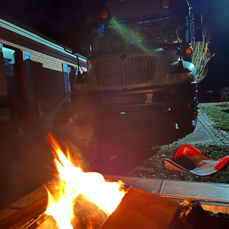 fire in front of converted skoolie