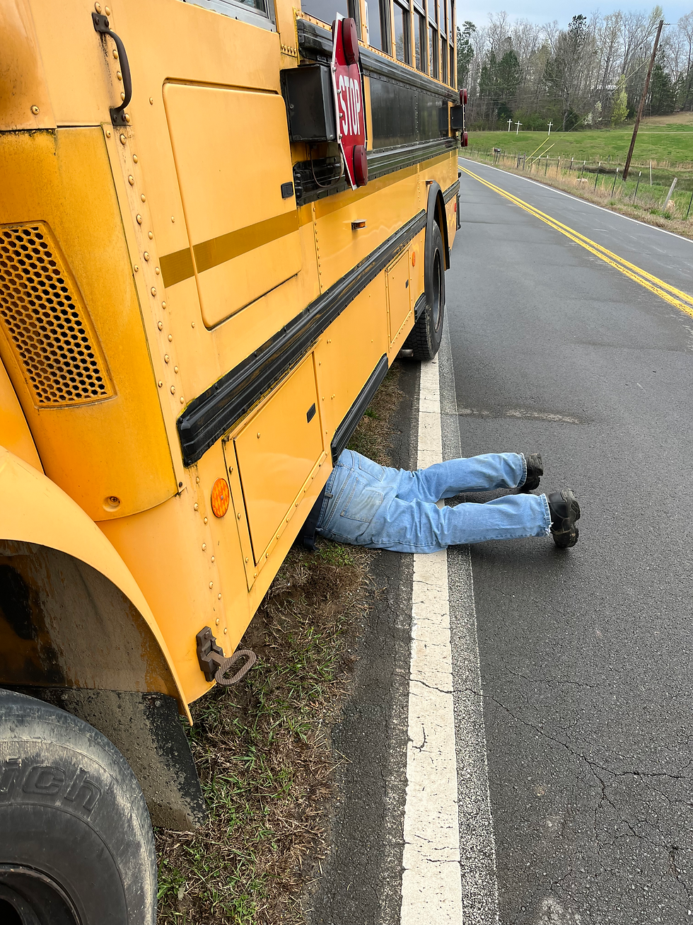 mechanic under bus 0271