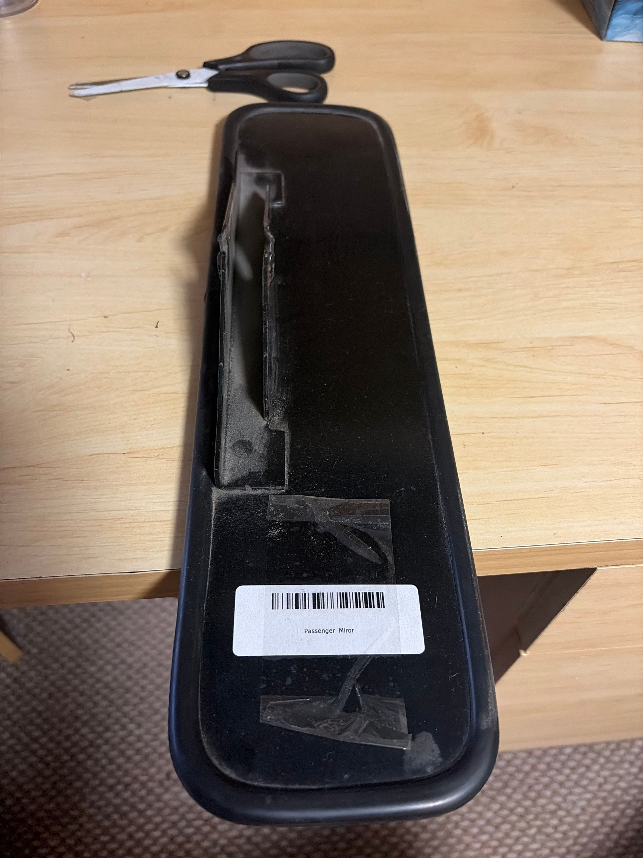 Interior passenger rear view mirror assembly