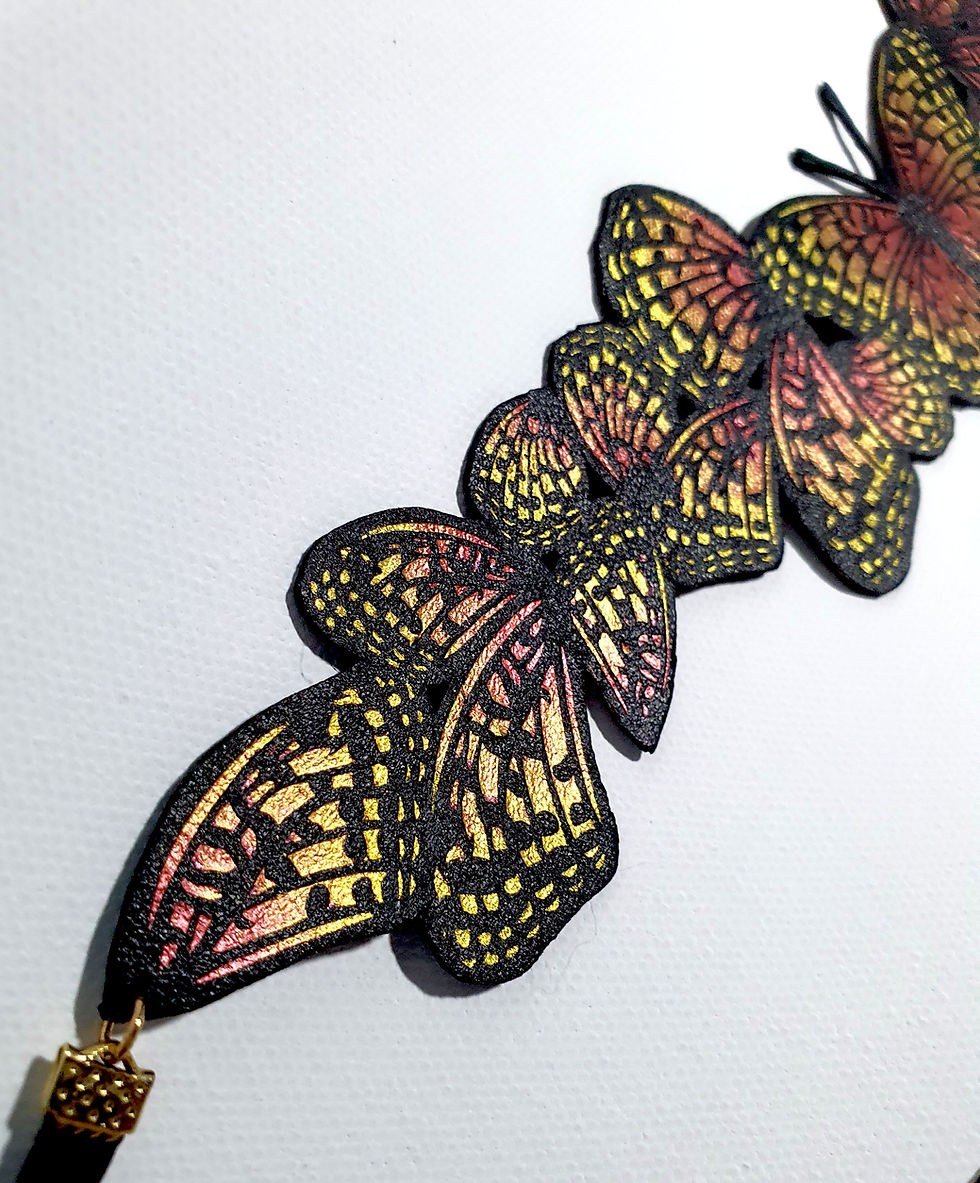 Metallic Gold Hand Painted Butterfly Wing choker zoomed in to show the detail along the edge where the ribbon ends start