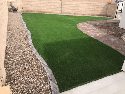Long curb run down a side yard along gravel