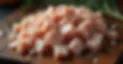 RAW CHICKEN DICED ON A WOODEN BOARD.jpg