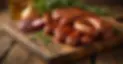 photo of sausages on a wooden board.jpg