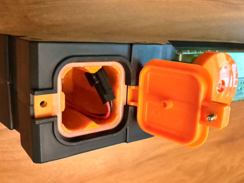 Macro close-up of captive screw and plastic boss in toy battery compartment door