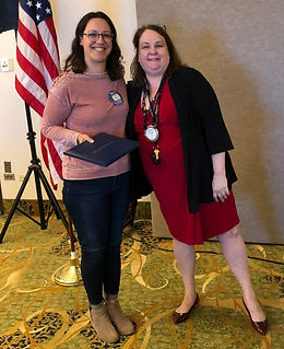 Lola Jones earns her Paul Harris from President Marcia Buckley at a Rotary of Newport meeting.