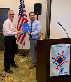 Jim Graham earn his "Blue Badge" at the Rotary Club of Newport, Oregon