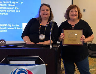 Newport Rotary President Buckley introduces new member Stephanie Linn.