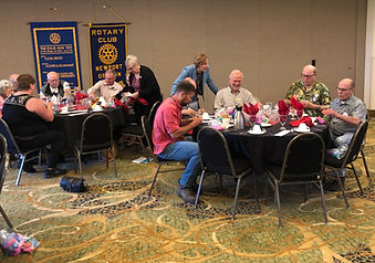 Newport Rotary Club members numbering dolphins.