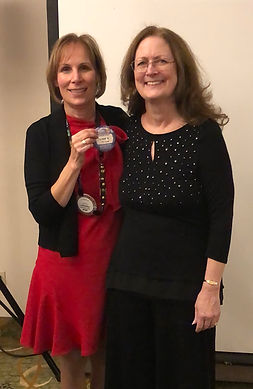 Newport Rotary President Hanrahan awards Doretta Smith her "Blue Badge."