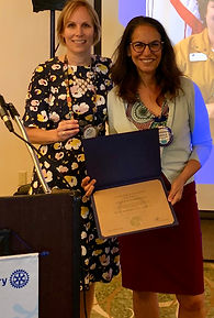 Ursula Marinelli earns a Paul Harris Fellow.