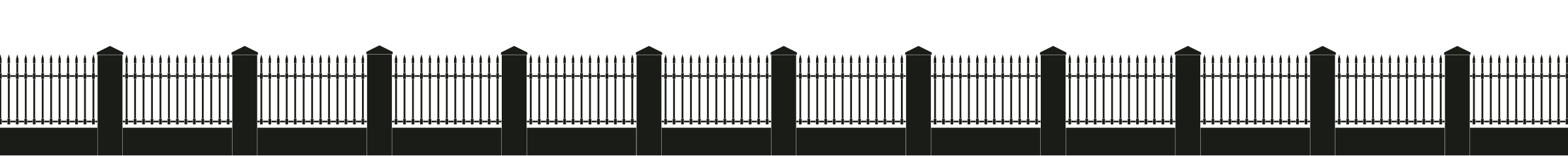 Silhouette of a stone wall with iron posts