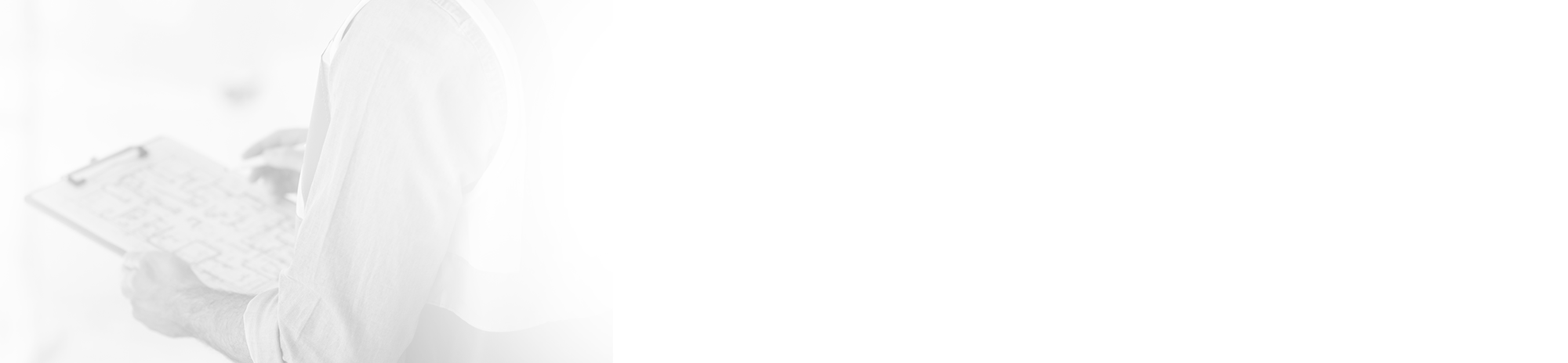 Person holding clipboard, blurred background, taking notes on document.