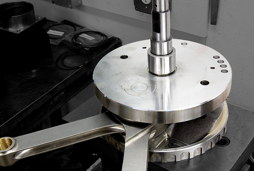 A motorcycle crankshaft being worked on in the Machine shop