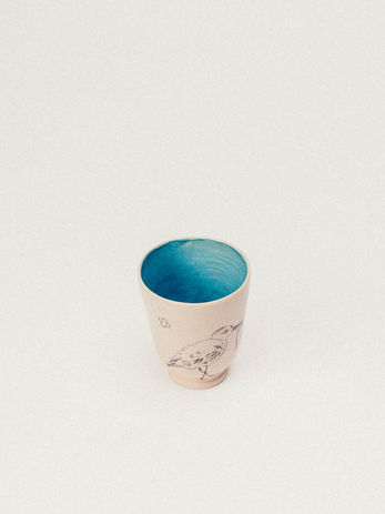 Cup with sandpiper drawing and a turquoise interior