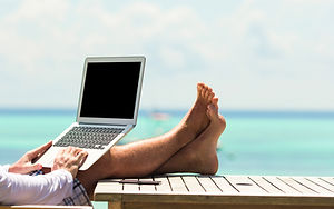 Young man with tablet computer during tr