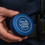 Thumbnail: Blue aluminum snus can with knurled grip and placeholder engraving reading 'Your Logo Here' for custom laser engraving