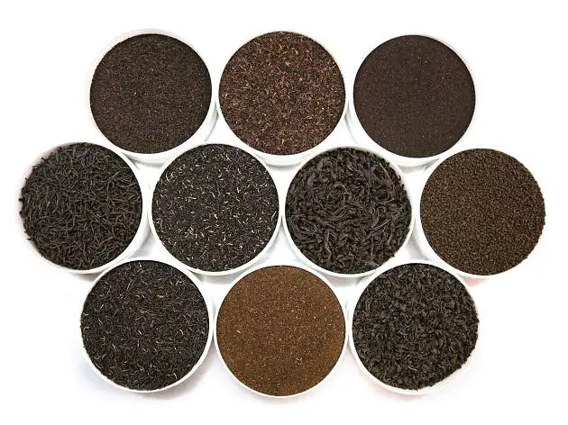 A variety of Kenyan CTC (Crush, Tear, Curl) and Orthodox teas, highlighting the distinct grades and rich colors of Kenyan tea, ideal for different tea blends and brewing preferences.